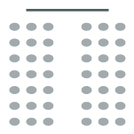 Two rows of chairs with a center aisle facing a stage at the front of the room.